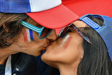 France’s fans kiss waiting for the start of the World Cup Group C soccer match between France and Australia at the Kazan Arena in Kazan, Russia, June 16, 2018.