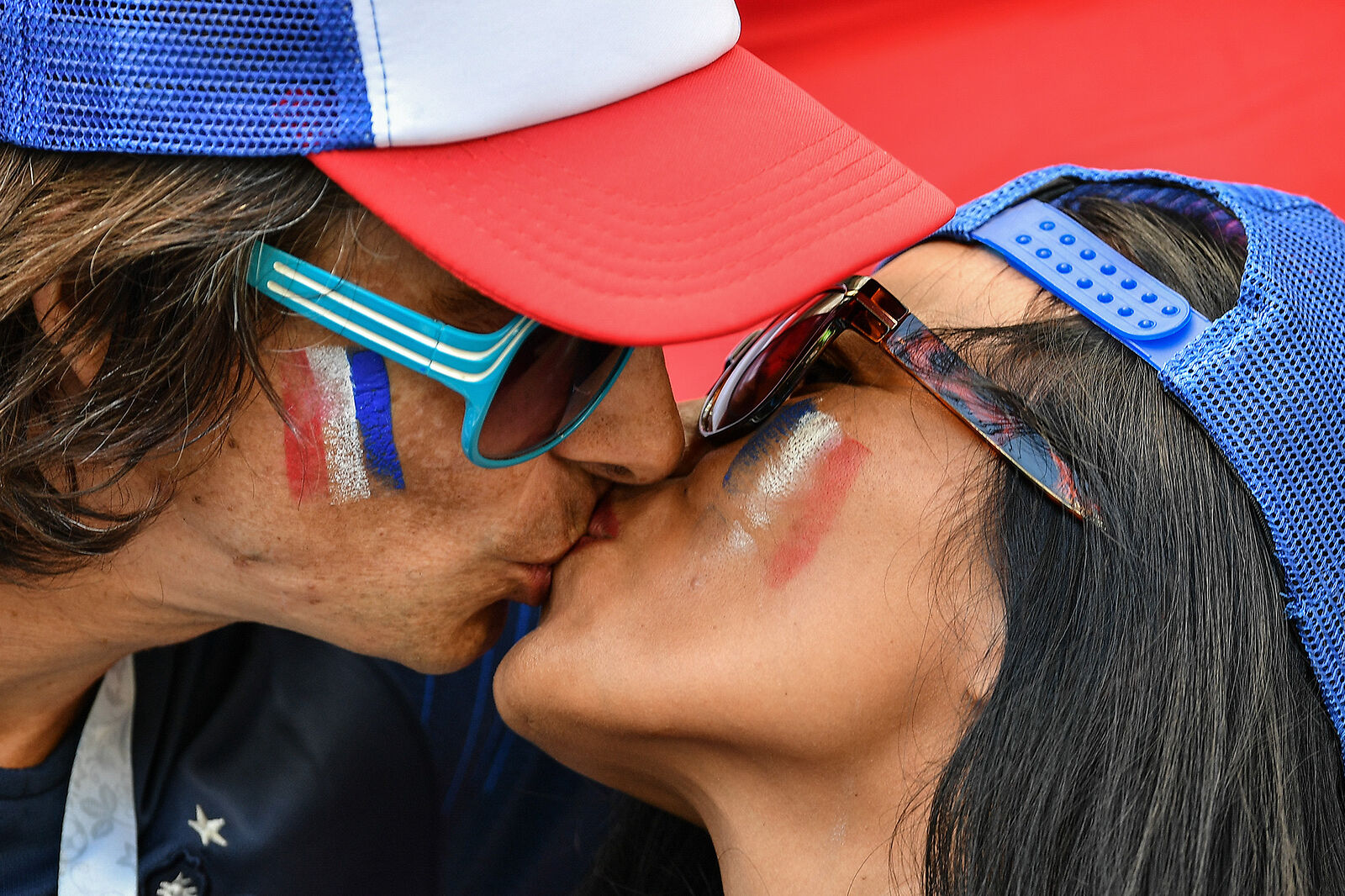 France’s fans kiss waiting for the start of the World Cup Group C soccer match between France and Australia at the Kazan Arena in Kazan, Russia, June 16, 2018.